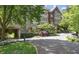 Elegant condominium complex featuring manicured landscaping, a covered parking area, and a welcoming entrance at 1717 N Decatur Ne Rd # 117, Atlanta, GA 30307