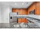 Modern kitchen with stainless steel appliances, granite countertops, and custom wood cabinets at 1717 N Decatur Ne Rd # 117, Atlanta, GA 30307