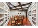 Resident library with wood floors, coffered ceilings, and extensive book collection at 1717 N Decatur Ne Rd # 117, Atlanta, GA 30307