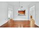 Bright room with hardwood floors and an open view into the kitchen with stainless steel appliances at 1717 N Decatur Ne Rd # 117, Atlanta, GA 30307