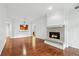 The living room features a fireplace, hardwood floors, and an open view of the kitchen at 1717 N Decatur Ne Rd # 117, Atlanta, GA 30307