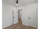 This bedroom features a closet and door to another room at 3634 Oakleaf Pass, Fairburn, GA 30213