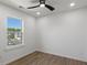 Empty bedroom features wood-look floors and natural light at 3634 Oakleaf Pass, Fairburn, GA 30213