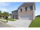 Charming two-story home features a combination of brick and siding, a two-car garage, and a well-manicured lawn at 3634 Oakleaf Pass, Fairburn, GA 30213