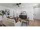Bright and inviting living room featuring hardwood floors and an open layout for seamless entertaining at 3634 Oakleaf Pass, Fairburn, GA 30213