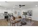 Open-concept living room with modern decor and plenty of natural light connecting the kitchen and living areas at 3634 Oakleaf Pass, Fairburn, GA 30213