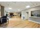 Common area with a kitchen, hardwood flooring, desks, tables and a lounge area at 377 Ralph Mcgill Ne Blvd # C, Atlanta, GA 30312