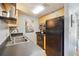 Compact kitchen with black appliances, modern countertops, and ample storage space at 377 Ralph Mcgill Ne Blvd # C, Atlanta, GA 30312