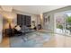 Comfortable living room with glass table, modern decor, and a sliding glass door to a balcony at 377 Ralph Mcgill Ne Blvd # C, Atlanta, GA 30312