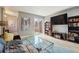 Bright and airy living room with hardwood floors, books, a large TV, and balcony access at 377 Ralph Mcgill Ne Blvd # C, Atlanta, GA 30312