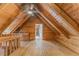 Unique attic featuring wood beams, wood floors and walls, and ample space at 519 E Valley Ne Rd, Rydal, GA 30171