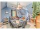Blue painted bedroom with a ceiling fan, window and closet at 519 E Valley Ne Rd, Rydal, GA 30171