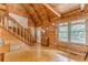 Bright living room featuring wood floors, high ceilings and staircase at 519 E Valley Ne Rd, Rydal, GA 30171