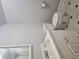 Updated bathroom featuring a shower, toilet, and single sink vanity with storage at 8291 Highway 5, Whitesburg, GA 30185