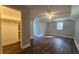 Spacious bedroom with a ceiling fan, window, walk-in closet and hardwood floors at 8291 Highway 5, Whitesburg, GA 30185