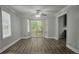 Bright dining area with hardwood floors, large windows, and easy access to the outdoor deck at 8291 Highway 5, Whitesburg, GA 30185