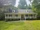 Charming single-story home with a welcoming front porch and well-manicured lawn at 8291 Highway 5, Whitesburg, GA 30185