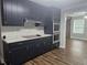 Modern kitchen featuring sleek black cabinets, stainless steel appliances, and ample counter space at 8291 Highway 5, Whitesburg, GA 30185