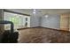 Open-concept living space featuring wood-look floors and a seamless flow to a possible dining space at 8291 Highway 5, Whitesburg, GA 30185