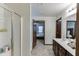 Bathroom featuring a glass enclosed shower, a bathtub, double sinks, and a walk-in closet at 893 Whitfield Oak Rd, Auburn, GA 30011