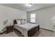 Cozy bedroom with natural light and neutral decor, creating a relaxing space at 893 Whitfield Oak Rd, Auburn, GA 30011