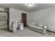 Bright bedroom featuring a sofa and desk area for study at 893 Whitfield Oak Rd, Auburn, GA 30011