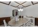 Elegant dining room with coffered ceilings, wainscoting, and a chandelier creating an inviting atmosphere at 893 Whitfield Oak Rd, Auburn, GA 30011