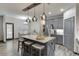 Modern kitchen with granite countertops, stainless steel appliances, and a stylish island with pendant lighting at 893 Whitfield Oak Rd, Auburn, GA 30011