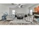 Cozy living room featuring comfortable seating, a fireplace, and large windows for natural light at 893 Whitfield Oak Rd, Auburn, GA 30011