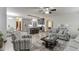 Open concept living room and kitchen with stainless steel appliances and hardwood floors at 893 Whitfield Oak Rd, Auburn, GA 30011
