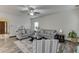 Spacious living room with neutral decor, a fireplace, and views into other rooms of the home at 893 Whitfield Oak Rd, Auburn, GA 30011