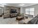Cozy living room featuring an accent wall and a comfortable sectional sofa at 893 Whitfield Oak Rd, Auburn, GA 30011
