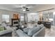 Open-concept living space with a fireplace, kitchen island, and modern finishes throughout the home at 893 Whitfield Oak Rd, Auburn, GA 30011
