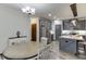 An open living space combines the kitchen and dining area for seamless entertaining at 893 Whitfield Oak Rd, Auburn, GA 30011