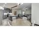 Open concept living space combining the kitchen, dining, and living areas at 893 Whitfield Oak Rd, Auburn, GA 30011