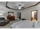 Open main bedroom with a seating area, large dresser, and access to a walk-in closet at 893 Whitfield Oak Rd, Auburn, GA 30011