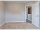 Bedroom with plush carpet, neutral walls, and an open doorway, creating a welcoming space at 12039 Quail Dr, Hampton, GA 30228
