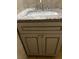 Bathroom vanity featuring a neutral color scheme, granite countertop, and cabinet at 2436 Glenrock Dr, Decatur, GA 30032