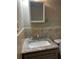 Bathroom vanity with a granite top, chrome faucet, and a mirrored cabinet at 2436 Glenrock Dr, Decatur, GA 30032