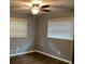 Cozy bedroom featuring hardwood floors, ceiling fan, and natural lighting at 2436 Glenrock Dr, Decatur, GA 30032