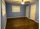 Bedroom featuring natural lighting, ceiling fan, hardwood floors, and white trim at 2436 Glenrock Dr, Decatur, GA 30032