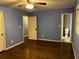 Spacious bedroom with hardwood floors, ceiling fan, and en-suite bathroom at 2436 Glenrock Dr, Decatur, GA 30032