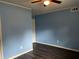 Well-lit bedroom showing a neutral color scheme, hardwood floors, and baseboard trim at 2436 Glenrock Dr, Decatur, GA 30032