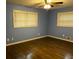 Cozy bedroom featuring hardwood floors, ceiling fan, and natural lighting at 2436 Glenrock Dr, Decatur, GA 30032