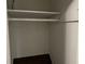 Walk-in closet featuring built-in shelving and hardwood floors at 2436 Glenrock Dr, Decatur, GA 30032