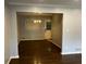 Dining room featuring hardwood floors, overhead chandelier and modern gray painted walls at 2436 Glenrock Dr, Decatur, GA 30032
