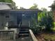 Rear entrance to the home with a set of stairs at 2436 Glenrock Dr, Decatur, GA 30032