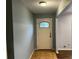 Entryway featuring a beige front door with glass, tiled flooring and gray painted walls at 2436 Glenrock Dr, Decatur, GA 30032