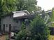 Back view of the home featuring painted brick, several points of entry, and some foliage at 2436 Glenrock Dr, Decatur, GA 30032