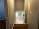 Hallway with hardwood floor leading to rooms with white painted walls at 2436 Glenrock Dr, Decatur, GA 30032